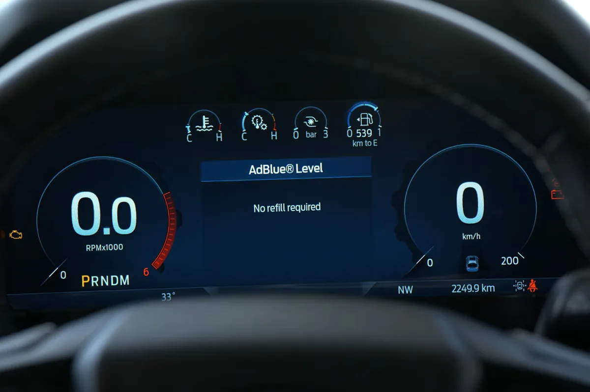 Vehicle instrument cluster showing the AdBlue level and remaining range