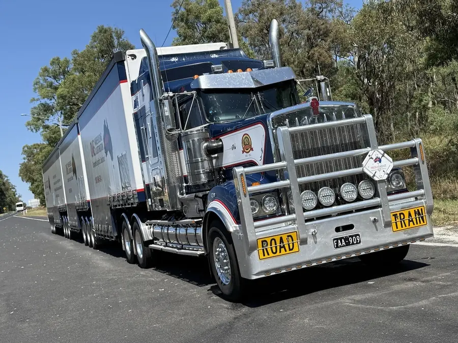Australian road train hauling linehaul freight on a country highway