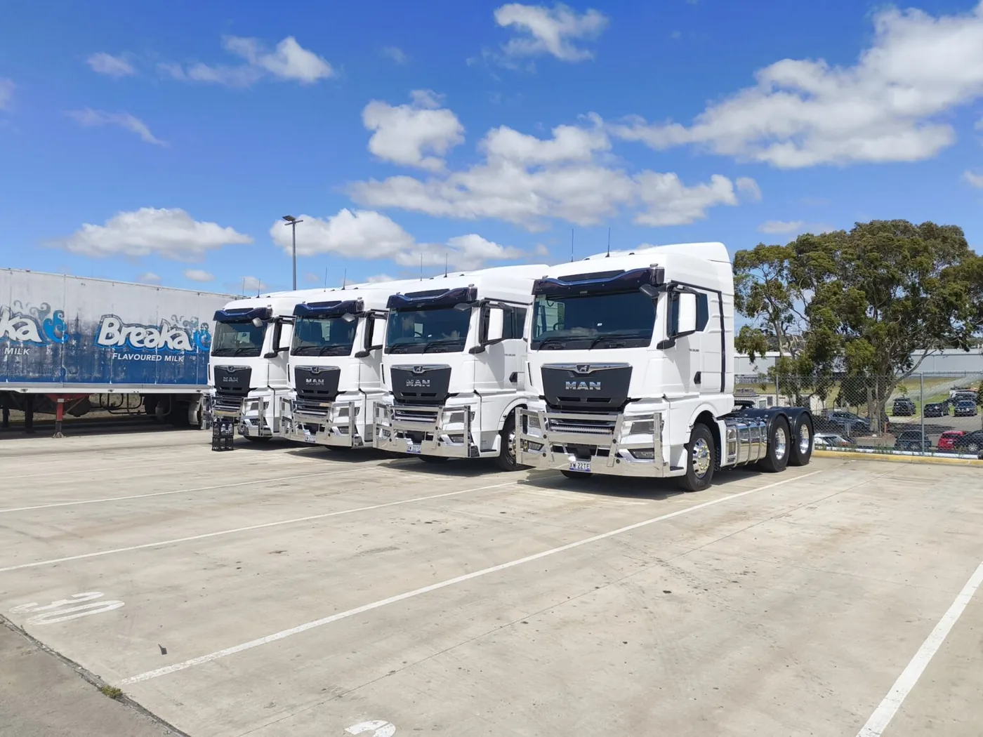 Fleet of prime movers lined up at an Australian transport depot