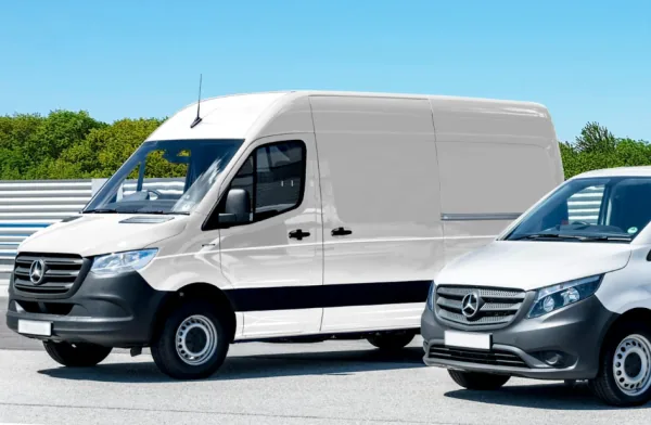 Two white commercial delivery vans